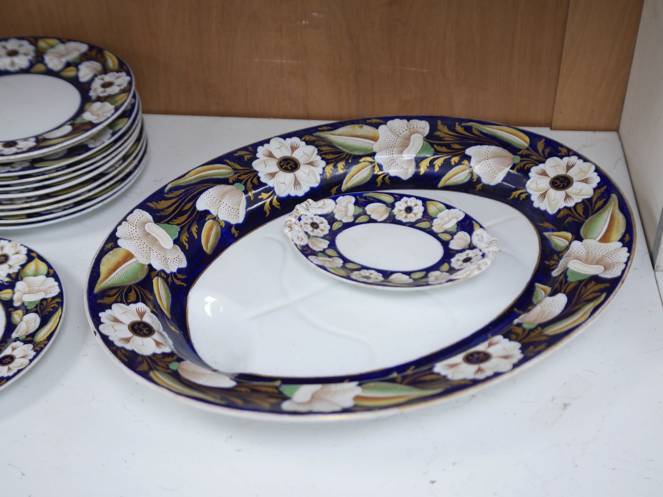 A Victorian Ironstone part set of floral decorated tableware. Condition - some items damaged